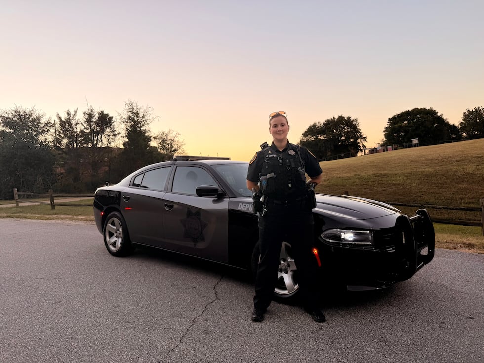 Deputy Cat Jumper stands in front of her patrol car in Greenville County.