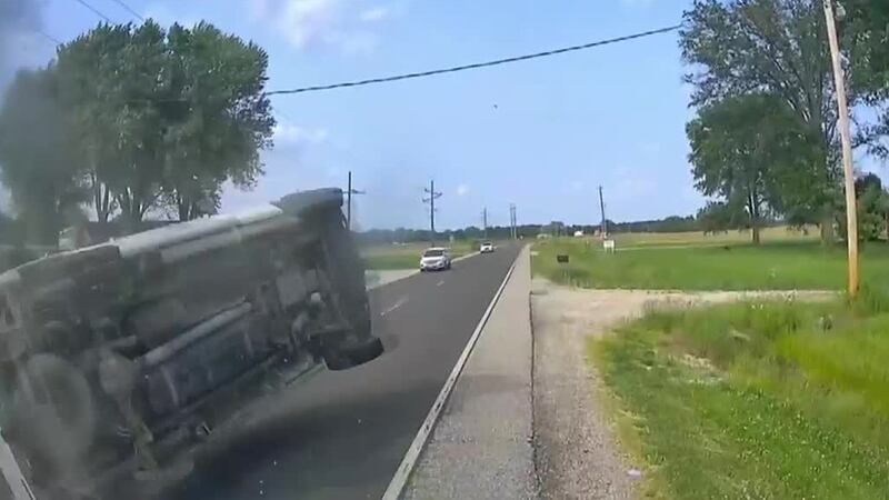 A van hits a tow truck and goes airborne.