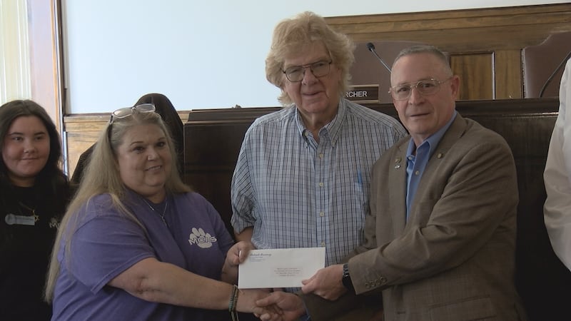 Delegate Doug Smith presented the check to shelter director Stacey Harman at the Mercer County...