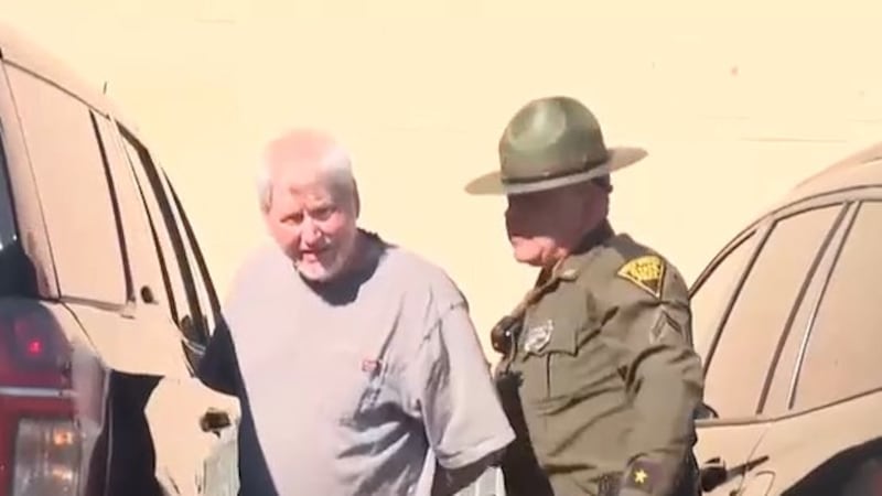 A West Virginia state trooper escorts Anthony W. Hay following a court appearance Friday.