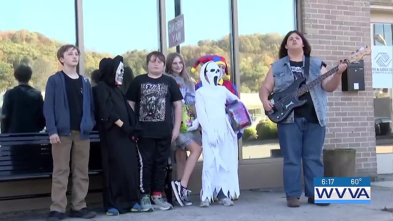 Kids from the club wore costumes and went door-to-door in downtown Bluefield, handing out...